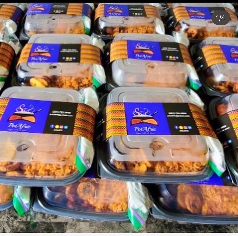 Stacked PotAfric branded takeaway meal packs