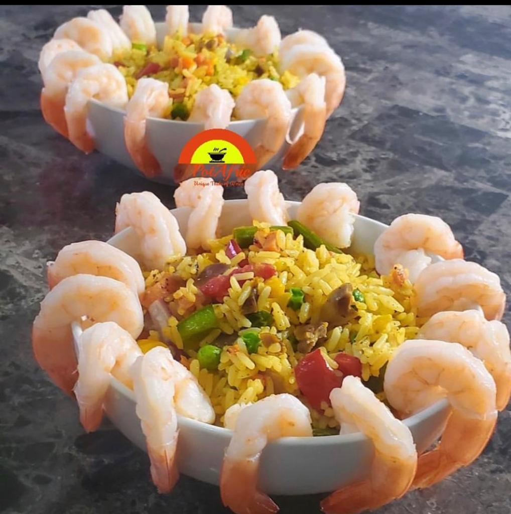 Shrimp-rimmed bowls of jollof fried rice